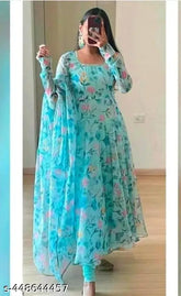 Blue designer georgette gown with long sleeves and printed net pattern. Traditional Indian ethnic or casual wear for special occasions