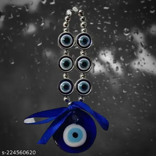 Blue glass Feng Shui Evil Eyes hanging for home & car, symbolizing good luck & prosperity. Dimensions: 7 cm x 10 cm x 7 cm