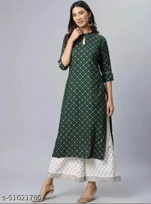 Rayon green women's kurta set with palazzos, printed three-quarter sleeves. Indian rayon fashion wear for women