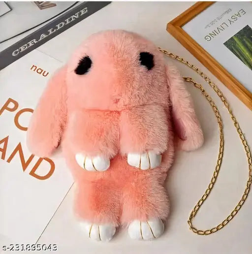 Pink plush rabbit sling bag, soft fabric material, 1 compartment, solid pattern, suitable for kids, presented by Kashish TradeLinks, removable golden chain strap