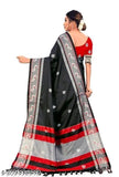 Ikat silk black saree with tassels and blouse, intricate woven design on soft silk fabric from India