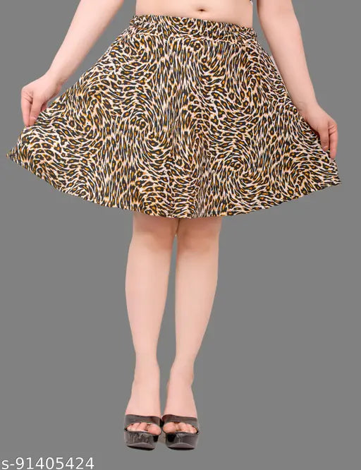 Printed polycrepe mini skirt, flattering skater style in fun printed pattern. Accessible for women sizes 28-34, suitable for daywear, nightwear, or work. Made in India