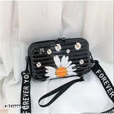 Black acrylic floral print sling bag, detachable shoulder strap, compact storage for travel essentials