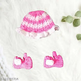 Handmade pink woolen blends kid's frock with socks and cap - Soft, comfortable, self-designed woven wool frock for baby girl in 6-9 Months, 6-12 Months, or 9-12 Months sizes. Made in India