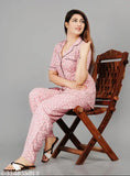 Printed pink rayon night suit set for women, short sleeves, vibrant design on display