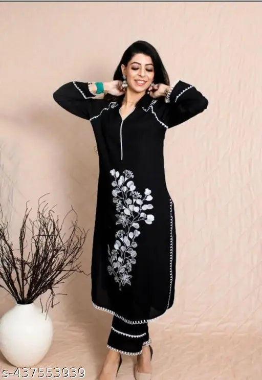 Black embroidered rayon Pakistani kurta pant set, three-quarter sleeves coord set on display