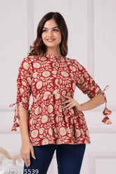 Maroon printed cotton designer top with mandarin collar, 3/4 sleeves, and pleats. Women's ethnic wear in soft colors for regular wear, tailored from Indian cotton." (109 characters)