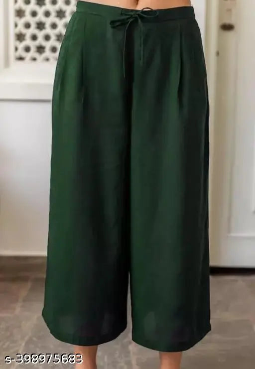 Attractive georgette kurta set with palazzos, solid net pattern, three-quarter sleeves. Indian women's fashion on display