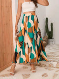 High waist print pleated maxi skirt, polyester with lining layer. Versatile midi skirt suitable for various occasions. Timeless printed pattern, regular fit, elastic waistband. Sizes: 28, 30, 32, 34, 36, 38, 38 (in) Origin: India