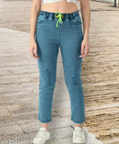 High-waisted blue stretchable premium denim jogger jeans with knee slit, baggy fit for women. 100% Indian manufacturer/promoter