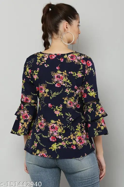 Navy crepe Trendy Classic Modern Top with printed floral pattern, three-quarter sleeves, and tie-up neck for women's garments. Layered sleeves add depth and texture, perfect for casual or formal events. Made in India." (124 characters)