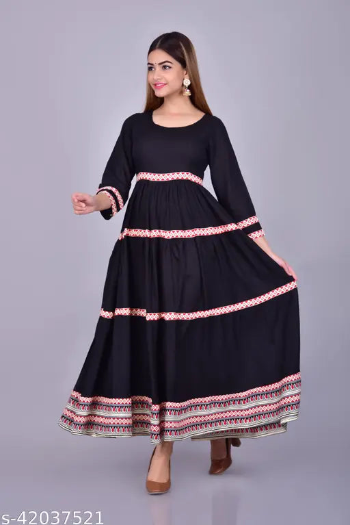 Black rayon kurti with three-quarter sleeves, solid pattern. Women's size S (36in bust/48in length) to XXXL (46in bust/48in length), ideal for a stylish, comfortable fit. Indian-origin garment