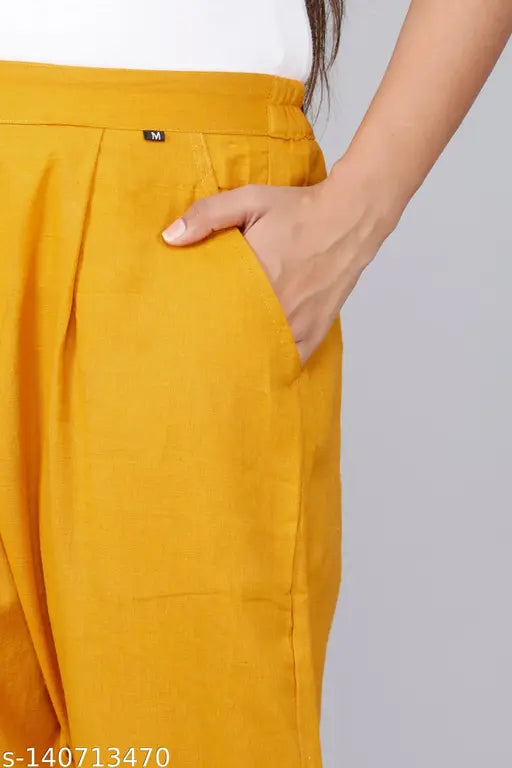 Gold casual cotton trousers by Rakshita Fashions, ankle length with pleats detailing and side pockets, comfortable for daily wear or travel