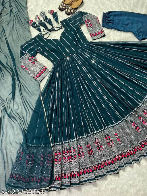 Designer blue party wear Anarkali suit in Georgette fabric with striped net pattern, three-quarter sleeves. Available in sizes S, M, L, XXL. Stunning addition to any event wardrobe. Genuine product by Fashion Basket, India