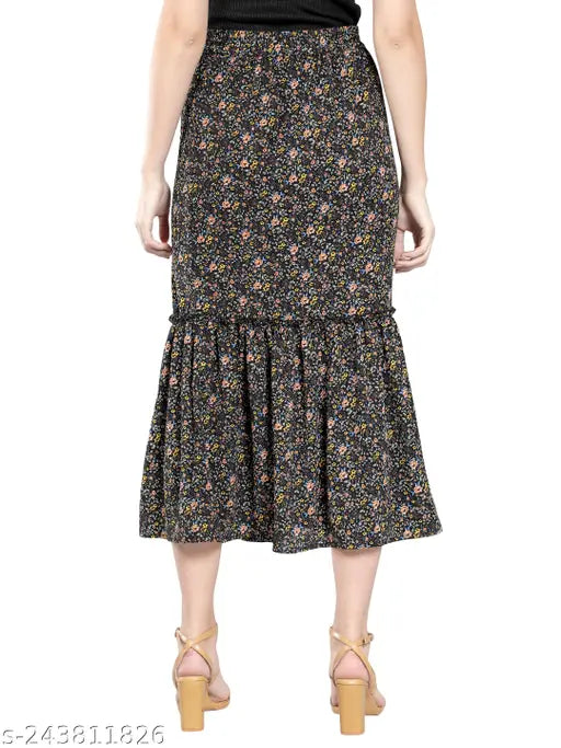 Black crepe floral printed midi skirt with side slit & frill, featuring ruffles and elastic waist, ideal for casual events. Made in India." (106 characters)