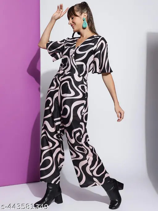 Women's poly blend printed V-neck half-sleeve western jumpsuit in Rama, Pink, Black, or Orange. Durable, wrinkle-resistant, and breathable fabric with eye-catching western-inspired patterns. Size S to XXL. Indian origin