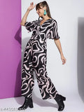 Women's poly blend printed V-neck half-sleeve western jumpsuit in Rama, Pink, Black, or Orange. Durable, wrinkle-resistant, and breathable fabric with eye-catching western-inspired patterns. Size S to XXL. Indian origin
