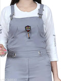 Grey cotton blend dungaree dress with adjustable shoulder straps and 3/4 sleeves for girls, featuring side pockets and drawstring waistband