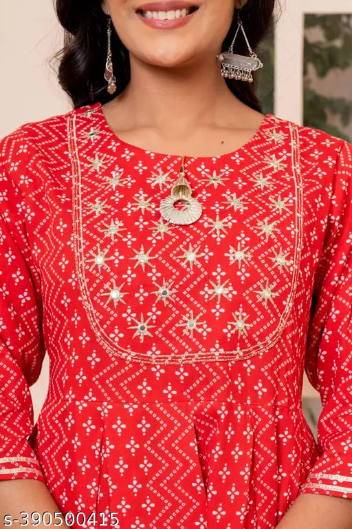 Red rayon kurta set with sharara and dupatta, featuring A-line style and exquisite embroidery for a festive celebration or casual outing