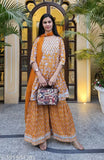 Mustard rayon kurta sharara set, three-quarter sleeves, printed with stitched net detail. India-made mustard kurta and bottomwear set for women