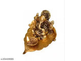 Gold-plated brass Ganesh idol with diya on leaf, ideal for pooja or festive occasions. Brand: MIHSA. India origin