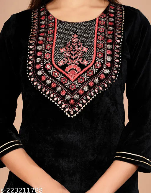 Black velvet kurta with ethnic embroidery, three-quarter sleeves. Women's winter wear from India