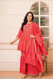 Red rayon women's kurta set with sharara and dupatta, featuring printed embroidery and three-quarter sleeves