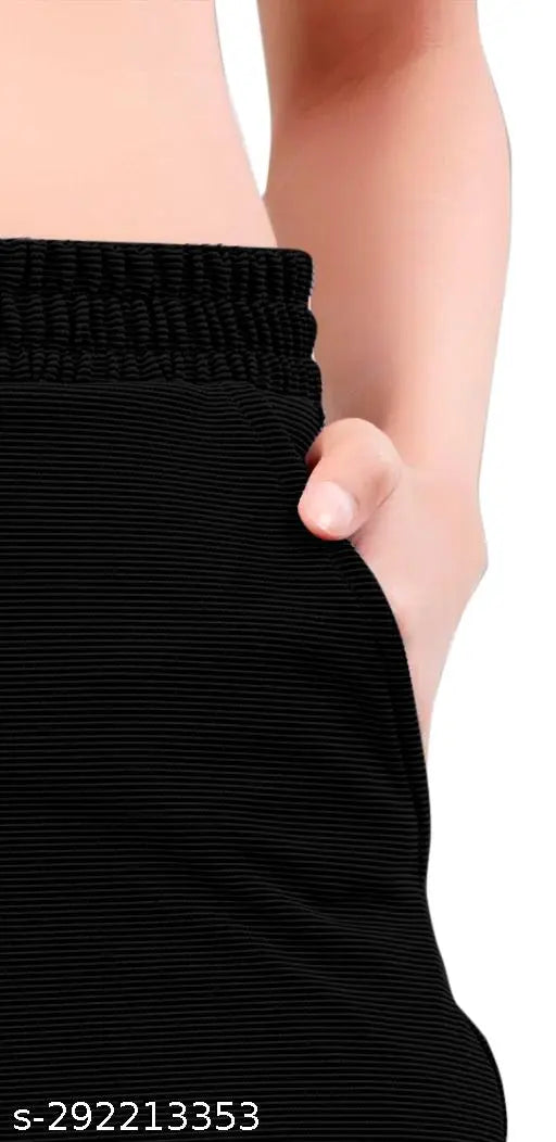 Black lycra women's regular-fit trousers, perfect for casual wear. High-quality imported straight leg pants made with 98% polyester and 2% lycra fabric, available in sizes S (28/38/28), M (30/38/30), XL (32/38/32). Origin: India