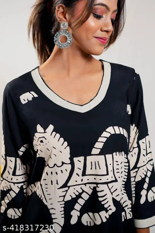 Black printed cotton blend kurta set with palazzos for women, featuring three-quarter sleeves and a net pattern. Single size available from S to XXL, made in India