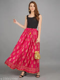 Pink rayon flared maxi skirt with gold print, elastic waistband, free size available. Traditional Rajasthani ethnic design, suitable for casual and Indian festive wear