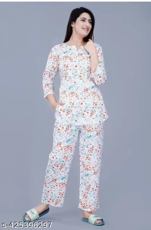 Trendy rayon printed nightwear set, including comfortable top and pajama sleepwear for ladies. V-neck, 3/4 sleeve, slip-on design. Made from soft rayon fabric for a cozy feel. Perfect for lounging or sleeping at home