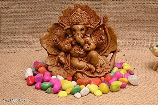 Brown resin Ganesh shoeflower idol, perfect for car dashboard puja ghar