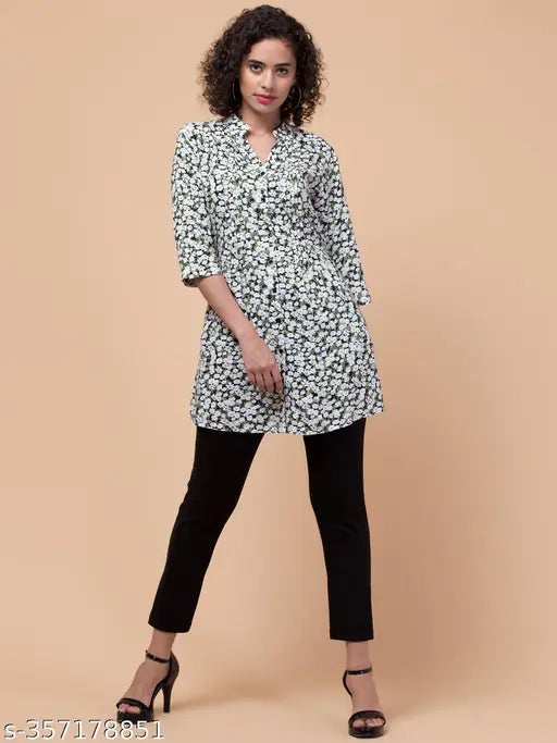 Green rayon floral tunic with mandarin collar, 3/4 sleeves & front pleats, size 34. Indian-made fashion tunic