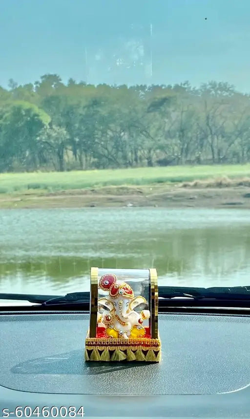 Multi-colored polyresin handcrafted Lord Ganesha idol for home decor and car dashboard, ideal for living room showpiece or gift item
