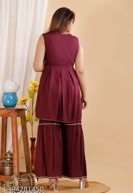 Maroon rayon kurti, sharara, and dupatta set with sleeveless A-line design, ready for various occasions