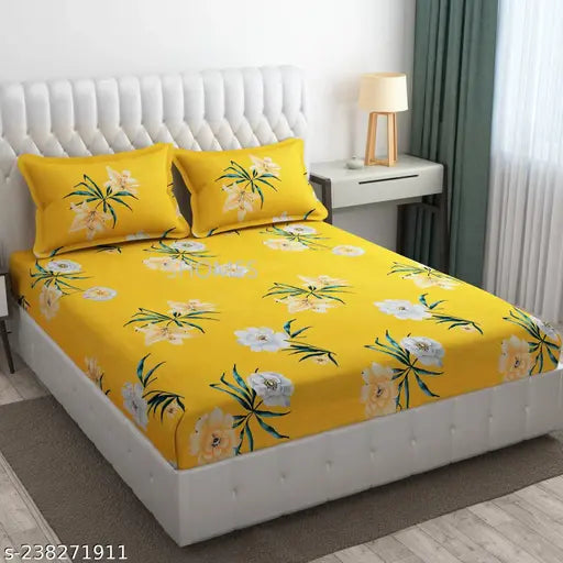 Yellow cotton elastic double bedsheet (72x78x8 inches) with two pillow covers, perfect for a king-size bed. Comfortable and wrinkle-free, enhancing your sleep experience