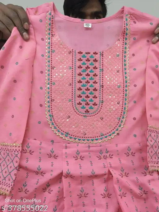 Pink rayon embroidered anarkali kurta with floral print, three-quarter sleeves, and maximum length for women's casual or festive wear. Available in various sizes (XS to 7XL). Indian origin