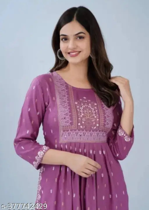 Baby pink rayon three-quarter sleeve top, printed combo design. Women's fashion accessory on hanger