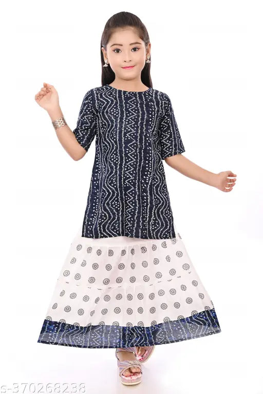 Navy blue kids' Jaipuri printed kurti skirt set on display, rayon material, straight top shape, above knee length, three-quarter sleeves