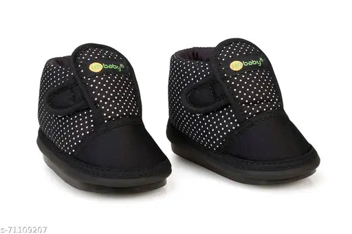 Polka print textile and PVC baby shoes for infants, featuring velcro fastening and chu-chu sound music. Designed for comfort, safety, and maximum breathability