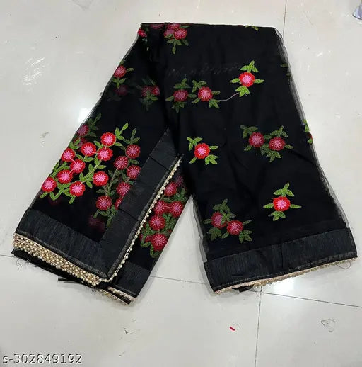 Black net saree with embroidered work and unstitched dupion silk blouse pieces, featuring all-over border moti work. Suitable for parties, weddings, or special occasions. Made in India