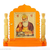 Orange-resin Guru Nanak glass idol with brass pillars for home, car, or office decor