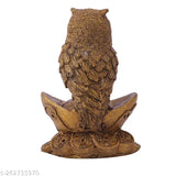 Synthetic resin Vastu owl statue sitting on gold Yuan Bao, symbolizing wealth and prosperity in Indian Feng Shui and Hinduism