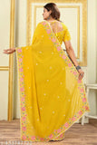 Yellow Georgette saree with embroidered border and unstitched blouse piece, Indian party/festival wear