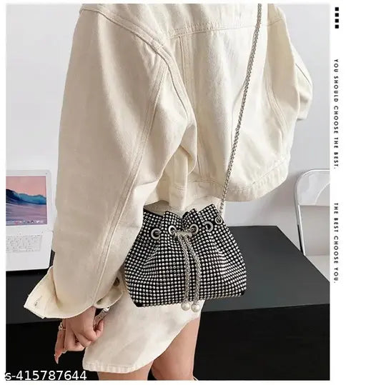 Synthetic rhinestone mini bucket bag with pearl pendant, adjustable drawstring chain strap. Solid black and silver color, multipurpose evening/wedding handbag. (6.3*3.9*5.1in / 16*10*13cm) Fits a 6.5 inch mobile phone. Made in India