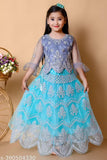 Embroidered net lehenga choli for girls festive wedding, featuring intricate mirror embellishments on flared skirt and blouse, India