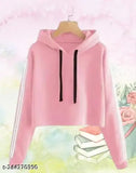 Trendy pink cotton blend crop hoodie for women, solid long sleeves on display