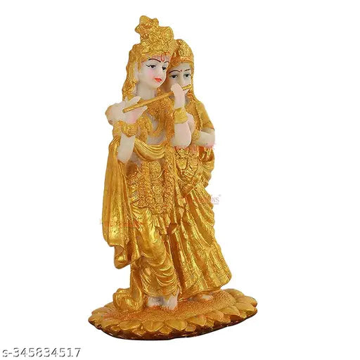 Resin Radha Krishna statues with gold accents, diya, and black tray. Indian decorative murti combo for home or temple decoration