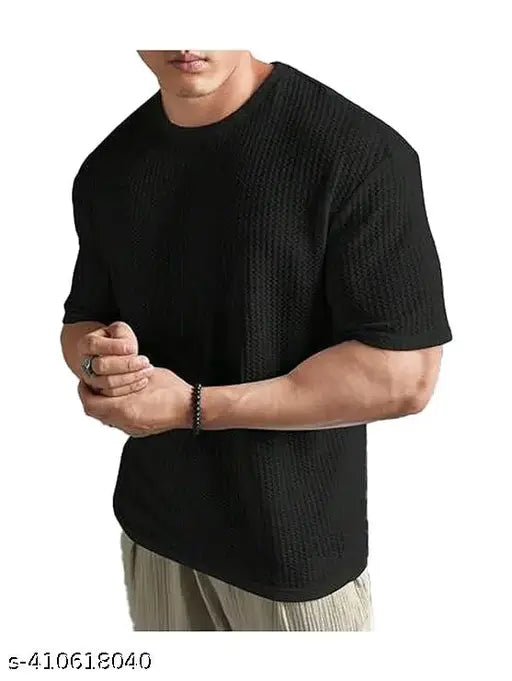 Men's cotton blend oversized dropshoulder T-shirt in solid round neck design, perfect for casual wear. Soft, breathable, and durable material for long-lasting comfort. Available in various colors and patterns. Made in India