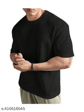 Men's cotton blend oversized dropshoulder T-shirt in solid round neck design, perfect for casual wear. Soft, breathable, and durable material for long-lasting comfort. Available in various colors and patterns. Made in India